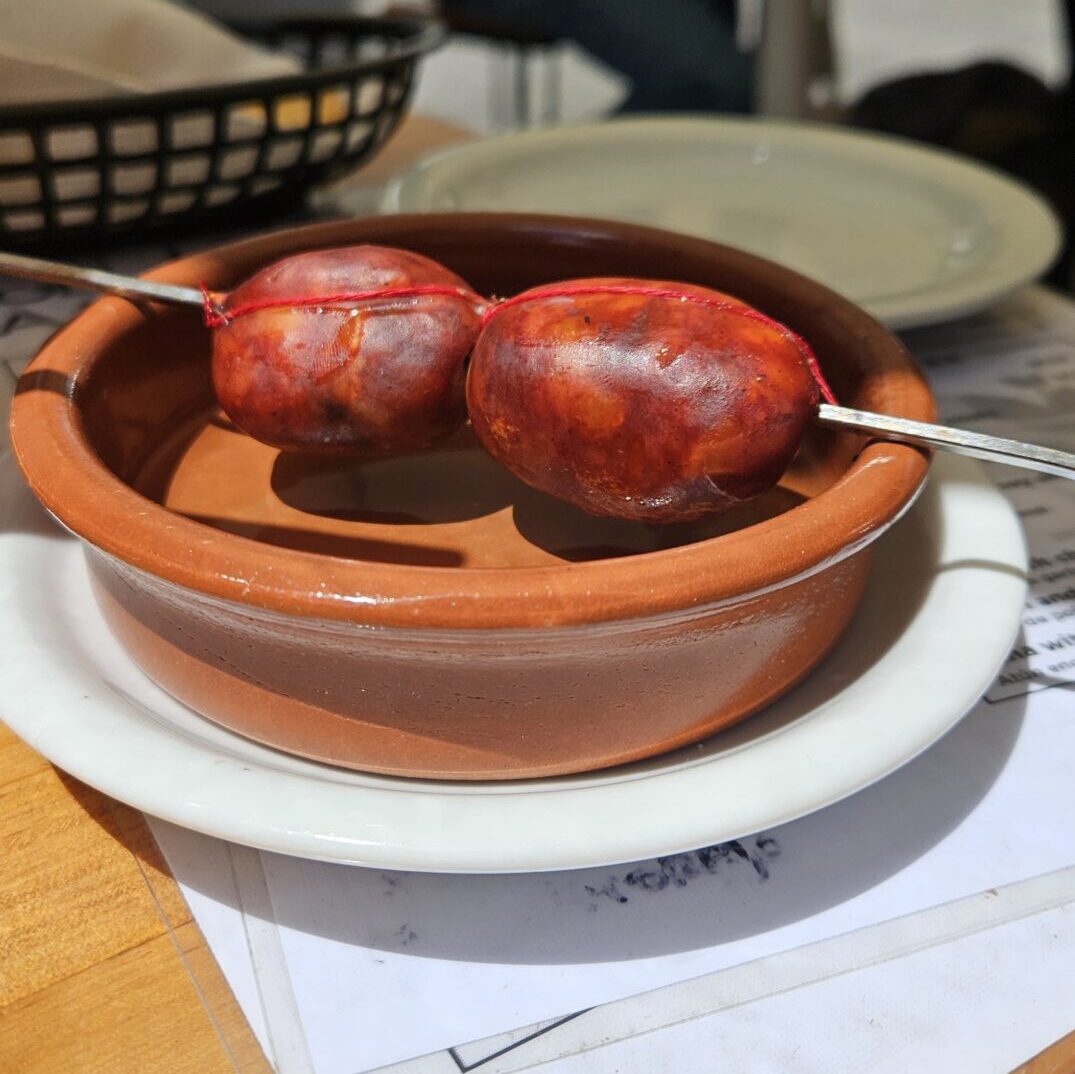 mini roasted chorizo in a tapas bar